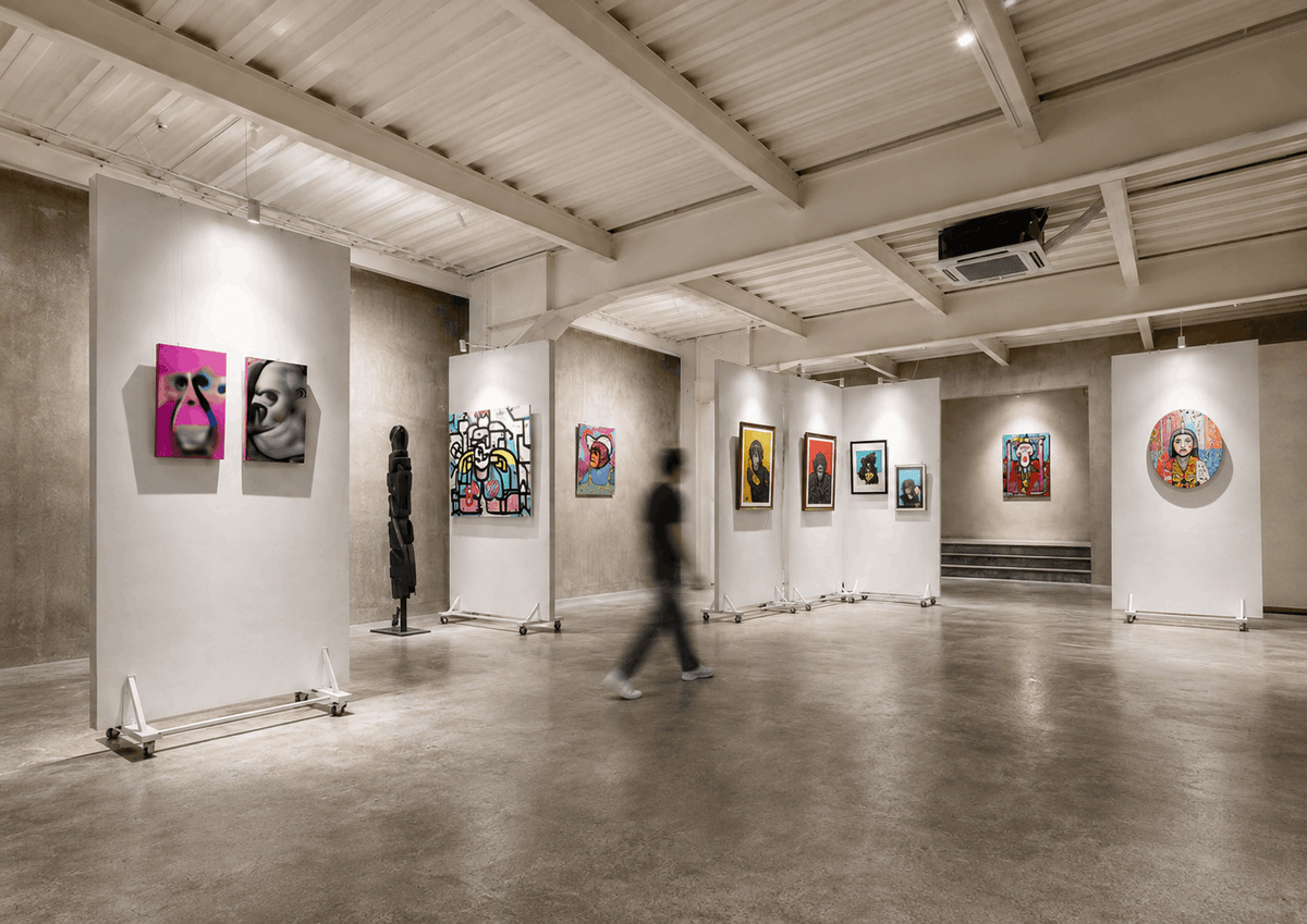 Visitor walking through the gallery at Blue Karma Creative Hub